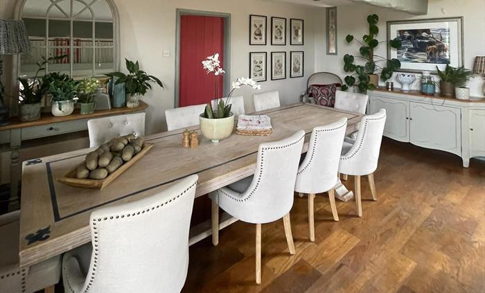 The main dining table in the lounge at ysgubor degwm self catering holiday let in North Wales. The table seats ten.